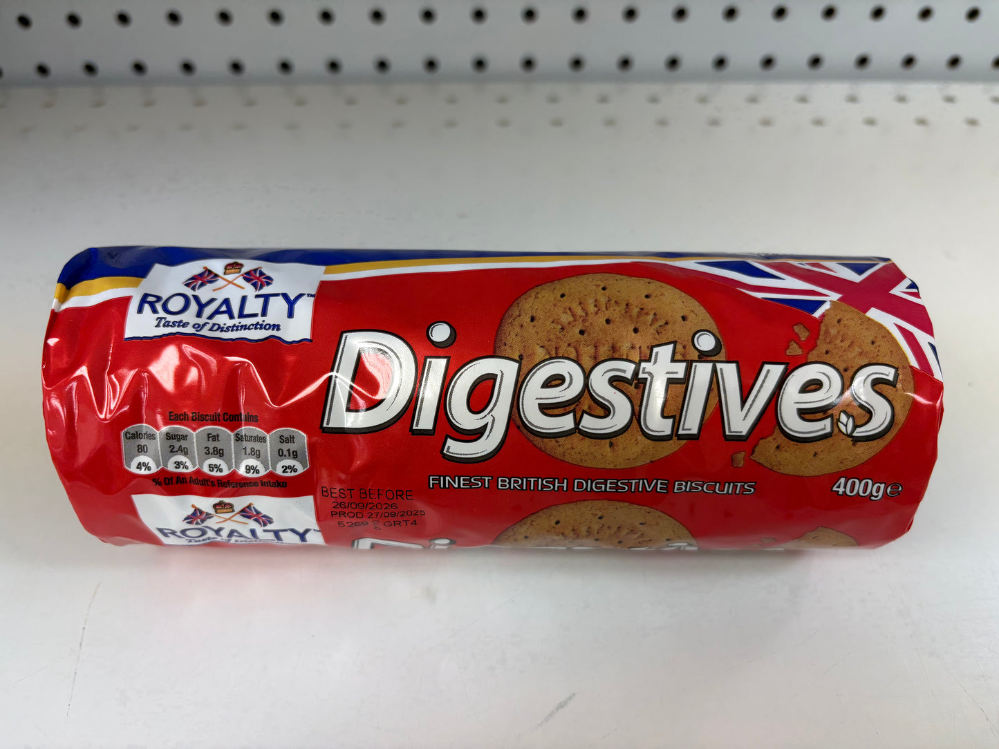 Roll of Royalty Digestives cookies on a white shelf