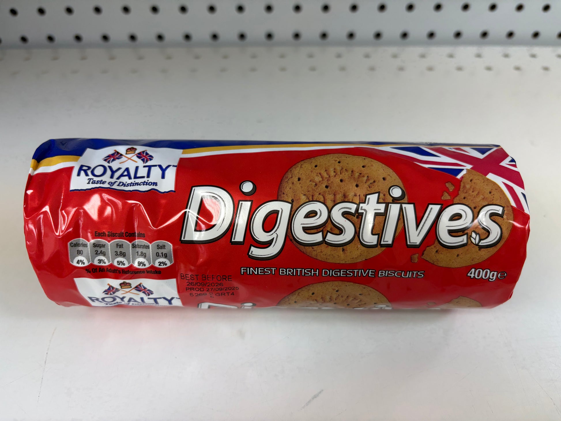 Roll of Royalty Digestives cookies on a white shelf